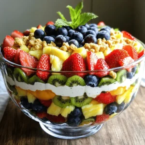 - 1 cup fresh strawberries, hulled and sliced - 1 cup plump blueberries, washed - 1 cup kiwi, peeled and diced - 1 cup pineapple, diced - 1 cup cream cheese, softened - 1/2 cup Greek yogurt, plain - 1/4 cup powdered sugar - 1 teaspoon pure vanilla extract - Zest of 1 fresh lemon - 1/4 cup crushed graham crackers - Fresh mint leaves for garnish When making this cheesecake fruit salad, fresh fruits are vital. I love using strawberries, blueberries, kiwi, and pineapple. They bring bright colors and sweet flavors. Strawberries add a juicy burst, while blueberries offer a slight tang. Kiwi brings a lovely tartness, and pineapple provides sweetness. Each fruit complements the creamy cheesecake mixture beautifully. The cheesecake mixture is where the magic happens. I use softened cream cheese and Greek yogurt for a rich texture. Mixing these two creates a smooth base. I add powdered sugar for sweetness and vanilla for flavor. The lemon zest brightens the mix and gives it a fresh kick. This mixture coats the fruit and makes each bite creamy and delightful. For a crunchy topping, I use crushed graham crackers. They add a nice texture contrast to the creamy fruit salad. Fresh mint leaves are the final touch. They not only look pretty but also add a refreshing scent. You can find the complete recipe above. Enjoy making this delicious and colorful treat! 1. Start by taking a large mixing bowl. Add the softened cream cheese and Greek yogurt into the bowl. 2. Use a hand mixer or a whisk to blend them. Mix until the texture is smooth and creamy. 3. Next, add the powdered sugar, vanilla extract, and lemon zest into the bowl. Continue mixing until all ingredients are well combined. 1. Grab a separate medium-sized bowl. Place the fresh fruits in this bowl. 2. Carefully toss the strawberries, blueberries, kiwi, and pineapple together. Use a spatula to mix gently. Be cautious not to mash any of the soft fruit. 1. With gentle hands, fold the cheesecake mixture into the bowl of mixed fruits. 2. Use a spatula to combine them carefully. Ensure the creamy mixture coats the fruit without breaking them apart. 3. When fully mixed, transfer the vibrant fruit salad into a serving dish or parfait bowls. For the full recipe, refer to the previous section. Enjoy creating your Cheesecake Fruit Salad! To get the best creamy texture, always use room temperature cream cheese. Cold cream cheese is hard to mix. A smooth blend makes the salad taste better. Adjust the powdered sugar based on your taste. If you like it sweeter, add more sugar. If you prefer less sweetness, reduce it. This way, you can customize the flavor to your liking. Choosing the right fruits is key. Use the best seasonal fruits for the best taste. Fresh berries, ripe kiwi, and juicy pineapple work well. If you want to swap fruits, you can. Try peaches, mangoes, or even grapes. The goal is to use fruits that you enjoy. Mixing different colors also makes the salad more appealing. Presentation matters when serving food. Use clear glass bowls to show off the colorful fruits. This makes the salad look fresh and inviting. A nice garnish can elevate your dish. Add fresh mint leaves for a pop of green. You can also add extra fruit slices on top. This not only looks great but adds more flavor. {{image_4}} To make your cheesecake fruit salad even better, try adding extracts. Almond or coconut extracts bring a fun twist. You can also use spices like cinnamon or nutmeg. These spices add warmth and depth to the flavors. Switching up the fruits keeps things fresh. Try using seasonal fruits like peaches or mangoes. They bring sweetness and a tropical vibe. You can also mix different berries. A blend of strawberries, blueberries, and raspberries gives a beautiful look and taste. If you want a lighter version, use low-fat cream cheese or yogurt. This keeps the dish creamy without all the fat. You can also add nuts or seeds for extra crunch. Chopped almonds or sunflower seeds work great and boost nutrition. For the full recipe, visit the Cheesecake Delight Fruit Salad section. To store leftover cheesecake fruit salad, place it in an airtight container. This keeps it fresh and prevents odors from other foods. Glass containers work well since they don’t stain or hold smells. Make sure the lid fits tightly to create a good seal. You can keep cheesecake fruit salad in the fridge for up to three days. After this time, it may lose its freshness. Signs that the salad has gone bad include a sour smell or a change in color. If the fruit looks mushy or the cream mixture separates, it’s best to toss it out. You can freeze cheesecake fruit salad, but the texture may change. The fruits can become mushy when thawed. If you want to freeze it, scoop portions into freezer-safe bags. To thaw, place the bag in the fridge overnight. This helps maintain some texture. Enjoy your salad within a week for the best taste! Yes, you can prepare Cheesecake Fruit Salad ahead of time. This salad tastes even better after chilling. Make the cheesecake mixture and cut the fruits the day before. Keep them in separate containers in the fridge. Just mix them together right before serving. This way, the fruit stays fresh and crisp. The best fruits for Cheesecake Fruit Salad are strawberries, blueberries, kiwi, and pineapple. These fruits add a sweet and tart balance. You can also use peaches, mangoes, or raspberries for variety. Choose any seasonal fruit that you enjoy. The key is to mix colors and flavors for a vibrant dish. To create a vegan Cheesecake Fruit Salad, swap cream cheese and yogurt for vegan options. Use cashew cream or coconut yogurt instead. For sweetness, maple syrup or agave works well. Make sure to use vegan graham crackers for the topping. This way, you can enjoy the same creamy and fruity delight without animal products. In this blog post, we explored how to make a delicious Cheesecake Fruit Salad. We covered fresh fruits, a creamy cheesecake mixture, and tasty toppings. I shared step-by-step instructions and helpful tips to perfect your salad. Remember, you can mix and match fruits or flavors to suit your taste. With the right ingredients, this dish can be a hit for any occasion. Enjoy creating this sweet, creamy treat that everyone will love!