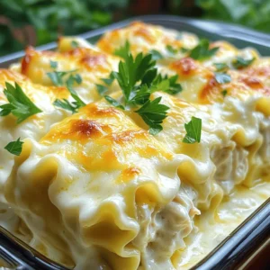 - 9 lasagna noodles - 2 cups cooked chicken, shredded - 1 cup ricotta cheese - 1 ½ cups mozzarella cheese, shredded - 1 cup Parmesan cheese, grated - 2 cups Alfredo sauce - 1 large egg - 1 teaspoon garlic powder - 1 teaspoon Italian seasoning - Salt and pepper to taste - Fresh parsley, chopped Each ingredient plays a key role in the dish. The lasagna noodles create a great base. I use cooked chicken for a hearty filling. Shredded mozzarella and grated Parmesan add a rich, cheesy flavor. Ricotta cheese gives the filling a creamy texture. The Alfredo sauce ties it all together, making every bite flavorful. For seasoning, I stick to garlic powder and Italian seasoning. A bit of salt and pepper lets the other flavors shine. Finally, fresh parsley adds a nice touch. It makes the dish look pretty and adds a hint of freshness. You can find the full recipe at the end for more detailed steps. Enjoy cooking! - Preheat the oven to 375°F (190°C). - Cook lasagna noodles and drain them well. Start by preheating your oven. This step is key. A hot oven helps your rolls bake evenly. Next, cook your lasagna noodles. Follow the package instructions closely. When they are tender yet firm, drain them. Lay the noodles flat to avoid sticking. - Combine chicken, ricotta, mozzarella, Parmesan, egg, and seasonings. In a large bowl, mix your filling. Add the shredded chicken first. Then, scoop in the ricotta cheese. Next, add the mozzarella and Parmesan. Crack in the egg for creaminess. Sprinkle in garlic powder and Italian seasoning. Don’t forget to add salt and pepper to taste. Stir until everything blends well. The mixture should be creamy and inviting. - Spread Alfredo sauce in the baking dish. - Roll the noodles with the filling and place in the dish. - Top with remaining Alfredo sauce and cheese. Now comes the fun part—assembling! Grab your baking dish and spread a layer of Alfredo sauce. Use about one cup to coat the bottom. This helps prevent sticking. Take a lasagna noodle and spoon 2-3 tablespoons of the filling onto it. Spread it out evenly. Carefully roll the noodle up from one end to the other. Place it seam-side down in the dish. Repeat this until all noodles are filled. Once they’re all in, pour the rest of the Alfredo sauce over the top. Make sure each roll is coated. Then sprinkle the rest of the mozzarella and Parmesan cheese on top. This will give you that gooey, cheesy finish when baked. Cover the dish with foil, sprayed lightly to avoid sticking. Bake for 25 minutes. After that, take off the foil and bake for another 15 minutes. You want the cheese to be bubbly and golden. Once done, let it cool for five minutes. Garnish with fresh parsley for a pop of color. Enjoy your Chicken Alfredo Lasagna Rolls! - How to cook lasagna noodles perfectly: To cook lasagna noodles well, boil them in salted water. Stir them lightly to keep them from sticking. Cook until they are al dente, which means they should still have a slight bite. This ensures they roll nicely without tearing. - Avoiding wet noodles for rolling: After cooking, drain the noodles and lay them flat on a clean towel. This helps absorb any extra water. Wet noodles can be hard to roll and may break apart. You want dry noodles for easy handling. - Keeping leftovers fresh: Place any leftovers in an airtight container. Store them in the fridge for up to three days. Make sure the rolls are fully cooled before sealing them. This keeps them tasty and safe to eat. - Reheating tips for best flavor and texture: When reheating, use the oven for best results. Preheat to 350°F (175°C) and cover the dish with foil. This keeps the rolls moist. Heat for about 20 minutes or until warm throughout. Enjoy them just like fresh! For the complete recipe, check the Full Recipe. {{image_4}} You can change up this recipe by using different cheeses. Try using fontina or gouda for a twist. You can mix in some feta for a salty bite. Each cheese adds its own flavor and texture. For sauces, you might switch the Alfredo for a homemade béchamel. It gives a creamy base with a hint of nutmeg. If you want, use a tomato sauce for a brighter taste. You can also play with meats. Swap out chicken for turkey or even mushrooms for a vegetarian option. Each choice brings new life to this dish. If you need gluten-free options, use gluten-free lasagna noodles. Many brands offer tasty alternatives that hold up well. They make it easy to enjoy this dish without worry. For a lighter meal, opt for low-fat cheese. You can find reduced-fat ricotta and mozzarella that still melt beautifully. This way, you enjoy the same creamy goodness with fewer calories. These changes allow everyone to enjoy Chicken Alfredo Lasagna Rolls without missing out on flavor. You can store Chicken Alfredo Lasagna Rolls in the fridge for about three to five days. Make sure to place them in an airtight container. This keeps them fresh and tasty. Always let the rolls cool down to room temperature before sealing them. If you want, you can also cover them tightly with plastic wrap. This helps prevent any fridge odors from seeping in. Freezing Chicken Alfredo Lasagna Rolls is a great way to save some for later. To do this, let the rolls cool completely first. Then, wrap each roll tightly in plastic wrap. After that, place them in a freezer-safe bag or container. Label it with the date so you remember when you made them. They can stay in the freezer for up to three months. When you're ready to eat, take the rolls out of the freezer. Thaw them in the fridge overnight. If you need them sooner, you can thaw them in the microwave on the defrost setting. To reheat, place the rolls in a baking dish with a bit of Alfredo sauce. Cover with foil and heat in the oven at 350°F (175°C) for about 20 minutes. This keeps them moist and delicious. Enjoy your Chicken Alfredo Lasagna Rolls! For the complete recipe, check out the Full Recipe section. To make Chicken Alfredo Lasagna Rolls from scratch, you need to start with a rich homemade Alfredo sauce. Make it using butter, heavy cream, and freshly grated Parmesan cheese. Melt butter over low heat, then stir in cream. Gradually add the cheese, stirring until it melts. Season with salt and pepper for added flavor. This sauce will bring creaminess and depth to your rolls. Yes, you can make Chicken Alfredo Lasagna Rolls ahead of time. Prepare the rolls and place them in the baking dish. Cover with plastic wrap and store in the fridge for up to 24 hours. This way, you save time on busy nights. Just remember to take them out of the fridge about 30 minutes before baking. This helps them cook evenly. For sides that complement Chicken Alfredo Lasagna Rolls, consider a fresh garden salad. A simple green salad with a light vinaigrette adds a nice crunch. Garlic bread is also a great choice. It soaks up the delicious Alfredo sauce. You could even serve steamed vegetables like broccoli or green beans for added nutrition. In this blog post, we covered how to make Chicken Alfredo Lasagna Rolls. We discussed the main ingredients, seasoning, and detailed steps for preparing the dish. We also shared tips for cooking, storing, and even variations you can try. In conclusion, this recipe is simple and fun to make. It allows for creativity with different ingredients. Enjoy your lasagna rolls, and don't forget to share them with friends!