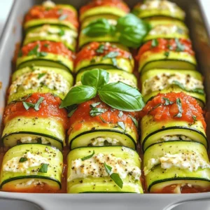 - 2 medium zucchinis, sliced lengthwise into thin strips (approximately 1/8 inch thick) - 1 cup ricotta cheese - 1 cup shredded mozzarella cheese - 1/2 cup grated Parmesan cheese - 1 large egg, lightly beaten - 1 teaspoon dried oregano - 1 teaspoon garlic powder - 1/2 teaspoon salt - 1/4 teaspoon freshly ground black pepper Zucchini is the star here. It gives a fresh taste and nice texture. I love using it because it holds up well when baked. Choose firm zucchinis for the best results. You will slice them thin to make roll-ups easy to handle. The cheese mix makes the dish rich and creamy. I use ricotta for its soft texture. Mozzarella adds stretch, while Parmesan gives a sharp bite. The egg helps bind everything together. The seasonings are simple but pack a punch. Oregano and garlic powder bring warmth and depth to the filling. - 1 cup marinara sauce I suggest using a good marinara sauce. You can go with your favorite brand. Look for one with natural ingredients. If you want, you can also make your own. Homemade sauce can add a personal touch and extra flavor. - Fresh basil - Additional cheese Garnishes elevate the dish. Fresh basil adds a pop of color and flavor. I also like to sprinkle more cheese on top before baking. This makes the roll-ups look and taste even better. If you want a rich finish, consider adding a drizzle of olive oil. Prepping the zucchinis Start by washing the zucchinis well. Use a mandoline slicer or a sharp knife to cut them lengthwise into thin strips. Aim for about 1/8 inch thick. Place these strips on a clean kitchen towel and lightly sprinkle them with salt. This step draws out moisture, helping the zucchini stay firm. Let them rest for 10 to 15 minutes. After this, use paper towels to gently pat the strips dry. Making the cheese filling In a large bowl, combine the ricotta cheese, shredded mozzarella, and grated Parmesan. Add in the beaten egg, dried oregano, garlic powder, salt, and black pepper. Mix everything well until it becomes a creamy filling. This blend will give your rolls a rich and tasty flavor. Rolling the zucchini strips Take one zucchini strip and place a generous spoonful of the cheese mixture at one end. Roll the strip tightly around the filling. If needed, use a toothpick to keep it in place. Repeat this step with all the zucchini strips. It helps to keep them snug but not too tight, so the filling doesn’t spill out. Placing roll-ups in the baking dish Spread half of the marinara sauce evenly across the bottom of your baking dish. Carefully arrange the roll-ups seam side down on top of the sauce. Drizzle the remaining marinara sauce over the top. This adds moisture and flavor during baking. Covering and initial baking Preheat your oven to 375°F (190°C). Cover the baking dish tightly with aluminum foil. Place it in the preheated oven and bake for 20 minutes. This steams the roll-ups, making them tender. Uncovering for the finish After 20 minutes, remove the foil. Continue baking for another 15 minutes. This will make the cheese bubbly and golden brown. Once done, take the dish out of the oven and let it cool for a few minutes. The roll-ups will be hot, so be careful. To make perfect Zucchini Dinner Roll Ups, avoid soggy zucchini. Start by salting the zucchini strips. Let them rest for 10-15 minutes. This helps draw out moisture. After that, pat them dry with paper towels. A dry zucchini rolls better and tastes great. Next, ensure your rolls are tight. When you place the cheese mixture at one end, roll it snugly. If the roll is loose, it may fall apart during baking. Use a toothpick if needed to hold the roll together. For flavor enhancements, spices work wonders. I suggest adding crushed red pepper for heat. Fresh herbs like thyme or parsley can bring brightness. You can also add a squeeze of lemon juice for a zesty kick. If you want more protein, try adding cooked ground turkey or chicken to the cheese mix. This adds protein and makes the dish heartier. You can also use cooked spinach for a veggie boost. When it comes to serving, pair your roll-ups with a light salad. A simple mixed greens salad goes well. You might also serve them with garlic bread for a filling meal. For presentation, arrange the roll-ups on a large platter. Drizzle extra marinara sauce over them. Add fresh basil leaves for color. This makes your dish look as good as it tastes. Enjoy your delightful and healthy meal! {{image_4}} You can get creative with fillings for your zucchini dinner roll ups. For a vegetarian option, try using a mix of roasted vegetables. Spinach, bell peppers, and mushrooms work great together. You can also add herbs like basil or parsley for more flavor. If you prefer meat-filled roll-ups, ground turkey or chicken is a tasty choice. Mix it with cheese and some spices for a hearty filling. The sauce you choose can change the whole dish. Instead of marinara, try pesto sauce. Its fresh taste pairs well with zucchini. Alfredo sauce is also a rich option that adds creaminess. For those who need dairy-free options, look for plant-based sauces. You can make a simple cashew cream or use store-bought dairy-free sauces. If you need gluten-free roll-ups, focus on the cheese. Use gluten-free cheeses like almond cheese or coconut cheese. They melt well and taste great. For sauces, check labels to avoid gluten. You can also make a homemade sauce with pureed tomatoes and herbs. This way, you control all the ingredients and ensure they are gluten-free. After you enjoy your Zucchini Dinner Roll Ups, store any leftovers in the fridge. Use an airtight container to keep them fresh. They will stay good for about three days. If you want to save them for later, freezing is a great option. Wrap each roll-up tightly in plastic wrap, then place them in a freezer bag. They can last up to three months in the freezer. When it's time to eat your leftovers, I recommend reheating in the oven. Preheat your oven to 350°F (175°C). Place the roll-ups in a baking dish and cover with foil. Heat for about 15-20 minutes until they are warm. This method helps keep the cheese gooey and the zucchini tender. You can also use a microwave for quick reheating. Just cover the dish to trap steam, and heat in short bursts. You can prepare Zucchini Dinner Roll Ups in advance. Make the filling and slice the zucchini a day before. Store the filling in the fridge and the zucchini strips in water to keep them fresh. On busy weeknights, simply roll them up and bake. This saves time while still delivering a tasty meal. You can also make a big batch and freeze them. Just bake them straight from the freezer. Enjoy a healthy meal anytime! To cut zucchini into strips, I recommend using a mandoline slicer or a sharp knife. First, wash the zucchini well. Then, slice off both ends. Set the zucchini on a cutting board and cut it lengthwise into thin strips, about 1/8 inch thick. A mandoline will give you even slices, making rolling easier. If using a knife, take your time for even strips. This helps the roll-ups cook evenly. Yes, you can make Zucchini Dinner Roll Ups ahead of time. Prepare the roll-ups but do not bake them. Place them in a baking dish, cover tightly with plastic wrap, and store in the fridge. They can stay fresh for up to 24 hours. When you're ready to cook, simply remove the wrap and bake as directed in the Full Recipe. This makes meal prep simple and stress-free. For serving, I recommend plating the Zucchini Roll Ups on a large platter. Drizzle extra marinara sauce over the top for added flavor. Garnish with fresh basil leaves for a pop of color. You can also serve them with a side salad or garlic bread. This makes the meal feel special and inviting, perfect for family dinners or gatherings. Yes, Zucchini Dinner Roll Ups are quite healthy! Zucchini is low in calories and high in vitamins. The cheeses provide protein and calcium, balancing the dish. By using fresh ingredients, you cut out processed foods. These roll-ups are a great way to enjoy veggies while satisfying your craving for comfort food. Plus, they are a fun way to sneak in more vegetables at dinner. In this blog post, we discussed how to make delicious Zucchini Dinner Roll-Ups. We covered key ingredients like zucchini, cheese, eggs, and marinara. You learned preparation steps, assembly tips, baking instructions, and how to store leftovers. The options for variations and serving suggestions make this dish fun and flexible. In closing, Zucchini Roll-Ups are a tasty way to enjoy healthy veggies. Give them a try for a quick meal that impresses. You’ll love how easy and versatile they are!