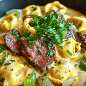 - 12 ounces cheese tortellini - 8 ounces ribeye steak, thinly sliced - 1 cup provolone cheese, shredded - 1 medium onion, thinly sliced - 1 green bell pepper, thinly sliced - 2 cloves garlic, minced - 1 tablespoon olive oil - 1 tablespoon Worcestershire sauce - Salt and pepper to taste - Fresh parsley, finely chopped The key to this dish is the balance of flavors and textures. First, choose high-quality cheese tortellini. Fresh tortellini adds a wonderful bite and helps soak up the sauce. Ribeye steak brings rich flavor and tenderness. Slice it thin to ensure quick cooking and a melt-in-your-mouth experience. For the sauce, provolone cheese is essential. It melts beautifully and gives a creamy texture. Pair it with sautéed onions and bell peppers for sweetness and a hint of crunch. Garlic adds a punch of flavor, while Worcestershire sauce enhances the savory notes. Finally, fresh parsley brings color and brightness to the dish. It’s a simple touch that makes a big difference. You can find the complete recipe for Cheesesteak Tortellini in Rich Provolone Sauce [Full Recipe]. Enjoy crafting this delightful meal! To start, bring a large pot of salted water to a boil. Add the cheese tortellini and cook until al dente, which means they should be firm to the bite. This texture is key because it keeps the tortellini from getting mushy in the sauce. After cooking, drain the tortellini but don’t rinse them. Rinsing removes the starch that helps the sauce stick. Next, heat a spacious skillet over medium-high heat and add olive oil. When the oil is hot, add your thinly sliced ribeye steak. Season it well with salt and pepper. Sear the steak for about 3 to 4 minutes. It should be browned but still tender. Once cooked, remove the steak from the skillet and place it on a plate. This step is important to keep the steak juicy. In the same skillet, toss in the sliced onion and green bell pepper. Cook these for about 5 to 6 minutes until they are soft and golden. Stir often to ensure they cook evenly. Then, add the minced garlic and sauté for just 1 more minute. This step releases a wonderful aroma that fills your kitchen and enhances the dish. Lower the heat to medium and pour in the heavy cream over the sautéed vegetables. Mix well, allowing it to gently simmer. The cream creates a rich base for our sauce. Gradually sprinkle in the shredded provolone cheese and Worcestershire sauce. Keep stirring until the cheese melts completely. This creates a smooth, creamy sauce that coats everything beautifully. Now it’s time to combine everything. Add the cooked ribeye steak back into the skillet, along with the drained tortellini. Gently fold the tortellini and steak into the rich provolone sauce. Make sure everything is well-coated. Taste your dish and adjust the seasoning with more salt or pepper if needed. For a great presentation, serve the dish in shallow bowls. This shows off the creamy sauce and vibrant colors. Garnish with freshly chopped parsley for a burst of color and freshness. I recommend pairing it with garlic bread, perfect for dipping into any leftover sauce. Enjoy your meal! For the complete recipe, check [Full Recipe]. To bring out the best flavors in your cheesesteak tortellini, use fresh herbs. I recommend: - Parsley: It adds a fresh touch. - Thyme: This herb brings warmth and depth. - Oregano: A classic choice that pairs well with beef. For cooking techniques, always sauté your vegetables first. This step builds a rich base for your sauce. Don’t rush this part; let them caramelize slightly for extra flavor. Maintaining the right texture of tortellini is key. Cook them just until al dente. This keeps them firm and prevents them from getting mushy in the sauce. For the cream sauce, if it feels too thick, add a splash of pasta water. This helps thin it out while keeping the flavor intact. If it's too thin, let it simmer a bit longer to thicken. One common mistake is overcooking the steak. Ribeye cooks quickly, so keep an eye on it. Aim for a nice brown color while keeping it tender. Another mistake is not balancing flavors. Taste your dish as you go. If it’s too salty, add more cream. If it’s bland, a touch more Worcestershire sauce can enhance the depth. Following these tips will help you create a dish that shines. For the full recipe, check out the complete guide! {{image_4}} You can switch the ribeye steak for other meats. Try chicken or turkey for lighter options. Ground beef or pork also work well. If you want to keep it meatless, use mushrooms or tofu. These choices add their own unique flavors and textures. Provolone cheese gives a creamy taste. But you can try mozzarella for a mild flavor. Cheddar adds sharpness, while gouda brings a smoky touch. Each cheese changes the dish's taste and feel. Mix and match to find your favorite! Want to boost nutrition? Add spinach or kale for color and vitamins. Broccoli or zucchini also works great in this dish. You can play with seasonings too. Try adding Italian herbs or a pinch of red pepper flakes for warmth. Each twist makes your meal special. For the detailed recipe, check the Full Recipe. To keep your cheesesteak tortellini fresh, store it in an airtight container. Place the dish in the fridge within two hours of cooking. It stays good for about three to four days. Make sure to let it cool down before sealing. This helps prevent moisture buildup. When reheating, avoid the microwave if possible. Instead, use a skillet over low heat. This keeps the texture nice and creamy. Add a splash of cream or broth to boost the sauce's flavor. Stir gently until heated through. You can also sprinkle some extra provolone cheese on top for a richer taste. You can freeze cheesesteak tortellini for later. Just make sure it is completely cool before freezing. Divide it into portions and use freezer-safe bags. It can last for up to three months in the freezer. When you’re ready to eat, thaw it in the fridge overnight. Reheat it on the stove, following the same method for best results. Cheesesteak tortellini combines two favorites: the classic cheesesteak and cheesy pasta. It hails from Philadelphia, where the cheesesteak was born. The dish features cheese-filled tortellini tossed with ribeye steak, peppers, and a rich provolone sauce. This meal brings comfort and flavor into one bowl, making it a perfect choice for family dinners. Yes, you can prepare cheesesteak tortellini in advance. Cook the tortellini and sauce separately. Store them in the fridge for up to two days. When you’re ready to eat, heat them together in a skillet. This way, you’ll keep the flavors fresh and delicious. Pair cheesesteak tortellini with garlic bread or a fresh salad. A side of sautéed vegetables also complements the dish well. These sides add texture and balance to the rich flavors of the tortellini. Absolutely! You can substitute provolone with mozzarella, gouda, or cheddar. Each cheese will change the flavor slightly. For a sharper taste, try aged cheddar. For creaminess, mozzarella works well. Experimenting with different cheeses can make the dish unique. To make cheesesteak tortellini gluten-free, choose gluten-free tortellini. Many brands offer this option, and they taste great. Check the labels for gluten-free ingredients in the sauce too. This way, everyone can enjoy this tasty dish. For the full recipe, click here. This blog post detailed how to make a delightful cheesesteak tortellini dish, featuring key ingredients like cheese tortellini, ribeye steak, and provolone cheese. We covered step-by-step instructions for preparation, cooking, and serving. Remember, the right texture and seasoning make all the difference. Explore variations to fit your taste, and store leftovers properly to enjoy later. With these tips and tricks, you can confidently whip up this dish any time. Happy cooking; delicious meals await!