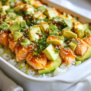 - 2 cups sushi rice - 2 ½ cups water - 10 oz fresh salmon, skinned and diced - 1 tablespoon mayonnaise - 1 tablespoon Sriracha (adjust to your spice preference) The main ingredients set the stage for your spicy salmon sushi bake. Sushi rice creates a great base. You need fresh salmon for flavor and texture. The mayonnaise and Sriracha mixture adds creaminess and heat. - 1 tablespoon rice vinegar - 1 teaspoon sugar - ½ teaspoon salt - ¼ ripe avocado, diced - 2 green onions, finely chopped - 1 tablespoon sesame seeds Seasoning is vital for taste. Rice vinegar, sugar, and salt balance the flavor of the sushi rice. Toppings like avocado, green onions, and sesame seeds bring freshness and crunch. - 1 sheet nori (seaweed), cut into thin strips - Soy sauce for serving Nori strips are perfect for dipping. They add a nice touch of umami. Soy sauce complements the dish well. It enhances the overall flavor with each bite. {{ingredient_image_2}} 1. Rinsing the Rice: Start by rinsing 2 cups of sushi rice under cold water. Keep rinsing until the water runs clear. This step removes excess starch and keeps your rice from being sticky. 2. Cooking the Rice: In a medium pot, combine the rinsed rice with 2 ½ cups of water. Bring it to a boil over medium-high heat. Once it boils, reduce the heat to low. Cover the pot and let it simmer for 15 minutes. After 15 minutes, take the pot off the heat. Leave it covered for another 10 minutes to steam the rice. 3. Seasoning the Rice: In a small bowl, mix 1 tablespoon of rice vinegar, 1 teaspoon of sugar, and ½ teaspoon of salt. Whisk until the sugar and salt dissolve. After the rice rests, fluff it gently with a fork. Slowly fold in the vinegar mixture. Allow the rice to cool slightly. 1. Combining Ingredients: In another bowl, take 10 oz of diced fresh salmon. Add 1 tablespoon of mayonnaise and 1 tablespoon of Sriracha. Stir gently until the salmon is well coated. You can add more Sriracha if you want more heat. 1. Layering the Bake: Preheat your oven to 375°F (190°C). In a medium baking dish, spread the seasoned sushi rice evenly at the bottom. Use a spatula to smooth it out. 2. Adding the Salmon: Evenly spread the salmon mixture over the rice. Make sure it covers the entire surface. 3. Adding Toppings: Sprinkle diced avocado, chopped green onions, and sesame seeds on top. Place the dish in the oven and bake for about 15-20 minutes. It’s ready when heated through and the edges are light golden brown. To make great sushi rice, start by rinsing it well. Rinse under cold water until it runs clear. This step removes extra starch. Starch can make the rice too sticky. Next, cook the rice with the right water amount. Use 2 ½ cups of water for 2 cups of rice. Bring it to a boil, then lower the heat. Cover the pot and simmer for 15 minutes. After that, let it rest for 10 more minutes. This helps the rice steam and become fluffy. Spiciness is key for flavor. Mix diced salmon with mayonnaise and Sriracha. You can adjust the amount of Sriracha to fit your taste. Want it milder? Use less Sriracha. Prefer it hotter? Add more. This way, you control the heat level. Presentation makes a dish shine. Serve your sushi bake in individual bowls for a nice touch. Garnish with extra sesame seeds and small avocado slices. These add color and texture. Don’t forget to include a side of soy sauce for dipping. The soy sauce complements the dish perfectly. Enjoy your meal! Pro Tips Rinse the Rice: Make sure to rinse the sushi rice until the water runs clear. This step removes excess starch and prevents the rice from becoming gummy. Adjust the Spice: Feel free to modify the amount of Sriracha in the salmon mixture according to your heat preference. Start with a smaller amount and add more if desired. Layer Evenly: When layering the rice and salmon, ensure each layer is spread evenly for consistent cooking and flavor in every bite. Let It Cool: After baking, allow the sushi bake to cool for a few minutes before serving. This helps the flavors meld and makes it easier to slice and serve. {{image_4}} You can switch out salmon for other fish. Tuna works great as a substitute. It has a nice flavor and pairs well with the other ingredients. Crab is another tasty option. Just make sure it’s cooked crab. Both options will give you a different but delicious twist. For a veggie version, use firm tofu. Press it to remove extra water, then cube it. Mix it with the same mayonnaise and Sriracha blend for flavor. You can also use vegetables like mushrooms or zucchini. These add great taste and texture to your bake. Want more flavor? Try adding spices like garlic powder or smoked paprika. A dash of sesame oil can also boost the taste. If you love heat, add more Sriracha or some chili flakes. These simple changes will make your sushi bake even more exciting! To keep your spicy salmon sushi bake fresh, store it in an airtight container. Make sure to let it cool first. Place it in the fridge if you plan to eat it within three days. If you have more than that, consider freezing it. When it's time to enjoy your leftovers, use the oven for best results. Preheat your oven to 350°F (175°C). Place the sushi bake in an oven-safe dish. Cover it with foil to keep it moist. Heat for about 15-20 minutes, or until warm. This method helps keep the rice fluffy. Yes, you can freeze your spicy salmon sushi bake! To do this, let it cool completely first. Then, cut it into portions. Wrap each piece tightly in plastic wrap and place them in a freezer bag. It will stay good for up to three months. When you're ready to eat, thaw it in the fridge overnight before reheating. Spicy salmon sushi bake is a fun twist on sushi. It combines sushi rice, fresh salmon, and a creamy sauce. You bake it all in a dish until warm and golden. This dish brings the flavors of sushi in an easy-to-serve format. It’s great for parties or family dinners. The spicy kick comes from Sriracha, but you can adjust it to your taste. Making this dish takes about 50 minutes in total. Here’s the time breakdown: - Prep Time: 20 minutes - Cooking Time: 15-20 minutes You will spend most of your time preparing the rice and mixing the salmon. The baking part is quick and easy. It’s perfect for a busy weeknight meal. Yes, you can make this dish ahead of time. Here are some tips: - Prepare the rice and salmon mixture early: You can store them separately in the fridge. Just keep them in airtight containers. - Assemble before baking: Layer the ingredients in the baking dish but do not bake it. Cover it tightly with plastic wrap. - Bake when ready: When it's time to eat, just pop it in the oven. It may need a few extra minutes to heat through. This makes it easy to enjoy a delicious meal with less stress! The Spicy Salmon Sushi Bake combines key ingredients like sushi rice, fresh salmon, and zesty toppings. You learned how to prepare each element step by step, ensuring delicious results. With helpful tips, you can perfect texture and customize flavors to your taste. Consider variations to suit different diets and enjoy the dish with tasty accompaniments. Don’t hesitate to try this dish and make it your own. It’s a fun way to enjoy sushi flavors right at home. Happy cooking!