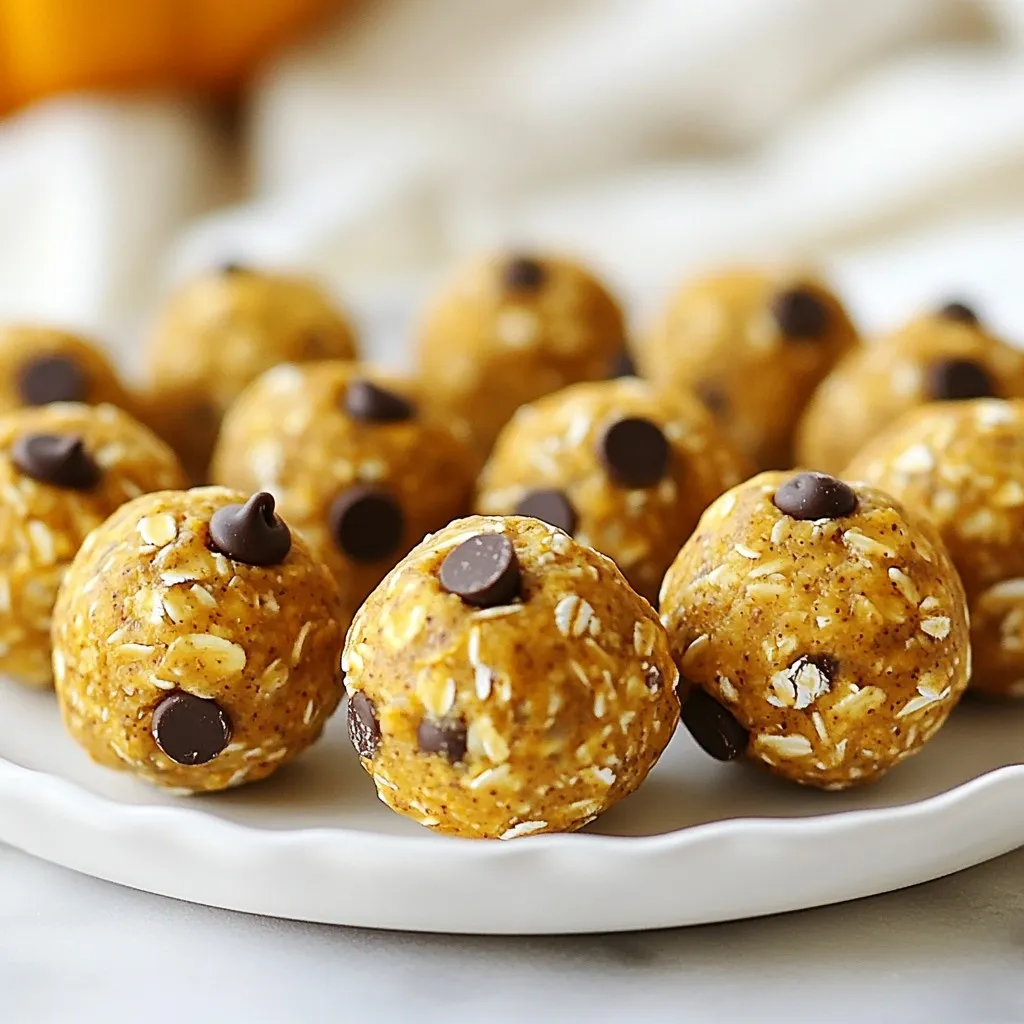 To make these tasty pumpkin protein balls, you need the following items: - 1 cup canned pumpkin puree - 1 cup rolled oats - 1/2 cup protein powder (vanilla or unflavored) - 1/4 cup almond butter (or peanut butter) - 1/4 cup honey or maple syrup - 1 teaspoon vanilla extract - 1 teaspoon pumpkin pie spice (or ground cinnamon) - 1/4 cup dark chocolate chips (optional) - A pinch of salt You can easily swap some ingredients. Almond butter works great, but you can use peanut butter if you prefer. Both add healthy fats. For sweetness, honey and maple syrup are interchangeable. Choose the one you like best. You can also skip the dark chocolate chips if you want to keep it simple. These pumpkin protein balls are not just tasty; they are good for you too! - Canned pumpkin: It is packed with vitamins A and C. It also adds moisture. - Rolled oats: They offer fiber, which helps you feel full longer. - Protein powder: This boosts protein content, supporting muscle growth and recovery. - Almond butter: It provides healthy fats and protein, which keep energy levels steady. - Honey or maple syrup: Both add natural sweetness and antioxidants. Using these ingredients makes for a snack that is both nutritious and satisfying. {{ingredient_image_2}} First, grab a large mixing bowl. Add 1 cup of canned pumpkin puree. Then, include 1/4 cup of almond butter or peanut butter. I like almond butter for its rich taste. Next, pour in 1/4 cup of honey or maple syrup. This gives our balls a sweet touch. Finally, add 1 teaspoon of vanilla extract for flavor. Mix everything with a spatula or whisk until it's smooth. In another bowl, whisk together 1 cup of rolled oats and 1/2 cup of protein powder. You can use either vanilla or unflavored protein powder. Then, add 1 teaspoon of pumpkin pie spice or ground cinnamon. This spice adds warmth and depth. Don't forget a pinch of salt to balance the flavors. Make sure all the dry ingredients blend well. Now, slowly add the dry mix to the wet mix. Stir gently but thoroughly until everything is combined. If you like dark chocolate, fold in 1/4 cup of chocolate chips. After mixing, cover the bowl and place it in the fridge for 30 minutes. This helps the mixture firm up. Once chilled, wet your hands to avoid sticking. Scoop about 1 tablespoon of the mixture and roll it into a ball. Repeat until you shape all the mixture. Place the balls on a baking sheet lined with parchment paper. You can store them in an airtight container. Enjoy them fresh or freeze them for later! When you mix your ingredients, start with the wet ones. Use a large bowl for this. Combine the canned pumpkin puree, almond butter, honey, and vanilla extract. Use a spatula or whisk to blend until it's smooth. This step ensures your balls will be tasty and moist. In a separate bowl, mix the dry items. Combine rolled oats, protein powder, pumpkin pie spice, and salt. Whisk them well. Then, add the dry mix to the wet mix. Stir continuously to blend everything well. This helps the flavors mix evenly. After mixing, chill the mixture for about 30 minutes. Chilling makes it easier to shape into balls. It also helps with the texture. To prevent sticking, wet your hands before shaping. This small trick is key! It helps the mixture glide off your hands. You can also use a scoop to measure out the mixture. This keeps them uniform. If you find the mixture too sticky, add a bit more oats or protein powder. Just a little will help! Make sure to keep your hands moist throughout the process. Presentation matters! For a nice display, use a colorful plate or a mason jar. This makes your snack look inviting. You can add a drizzle of melted chocolate on top for a sweet touch. This not only looks good but also adds flavor. Lastly, consider adding some nuts or seeds around the balls on the plate. This adds color and texture. Enjoy your tasty pumpkin protein balls! Pro Tips Chill for Best Results: Refrigerating the mixture for 30 minutes not only helps in shaping the balls but also enhances the flavors, making them more enjoyable. Customize Your Sweetness: Adjust the amount of honey or maple syrup according to your taste preference. You can even experiment with other sweeteners like agave or stevia. Add Texture: For added crunch, consider mixing in nuts, seeds, or dried fruits into the mixture before rolling them into balls. Perfect for Meal Prep: These protein balls make an excellent snack for busy days. Prepare a batch and store them in individual containers for grab-and-go convenience! {{image_4}} To make vegan pumpkin protein balls, simply swap the honey for maple syrup. This keeps the sweet taste while making it plant-based. You can also use a vegan protein powder. This makes the snack suitable for everyone, even those who avoid animal products. If you need gluten-free protein balls, ensure your oats are certified gluten-free. Most rolled oats are fine, but it's good to check. You can also substitute the protein powder with a gluten-free option. This way, you can enjoy a tasty snack without any worries about gluten. You can add nuts, seeds, or different spices to the mix. Try adding chopped walnuts or sunflower seeds for extra crunch. You can also mix in spices like nutmeg or ginger for unique flavors. For a sweet twist, fold in dark chocolate chips. Each of these additions brings new flavors and textures. Experiment with what you like best! To keep your pumpkin protein balls fresh, store them in an airtight container. This helps them stay moist and tasty. You can place them in the fridge for easy access. Just remember to seal the container well. This will keep them from drying out. If you want to save some for later, freezing works great. First, roll the balls as you normally would. Then, place them on a baking sheet lined with parchment paper. Freeze them for about an hour until they are firm. After that, transfer the balls to a freezer bag or container. Make sure to label the bag with the date. This way, you know how long they have been in the freezer. In the fridge, pumpkin protein balls last about a week. They are still good but best eaten within this time. In the freezer, they can last up to three months. This makes freezing a smart choice if you want them to last longer. Just remember to thaw them in the fridge before eating. They will taste fresh and delicious after freezing! You can make these pumpkin protein balls healthier in a few ways. First, consider using a natural nut butter with no added sugar. This option boosts healthy fats while cutting down on sugar. You can also swap out the chocolate chips for nuts, seeds, or dried fruits. Adding chia seeds or flaxseeds can increase fiber and omega-3s. Lastly, try reducing the sweetener amount. Your taste buds may adjust, and you’ll still enjoy the flavor. Yes, you can use several sweeteners in place of honey or maple syrup. Agave syrup is a great choice. It has a mild taste and is easy to mix. If you want to cut sugar even more, try using mashed bananas or unsweetened applesauce. These options will add natural sweetness and moisture to your protein balls. Just remember, different sweeteners may change the taste slightly, so adjust based on your preferences. There are many fun ways to enjoy pumpkin protein balls! You can have them as a quick snack on the go. They are also perfect after a workout. Pair them with a piece of fruit for a balanced meal. For a special treat, serve them with a cup of tea or coffee. You can even create a fun snack board with different dips, like yogurt or nut butter, for a delightful experience. We covered how to make delicious pumpkin protein balls. You learned about the key ingredients, with useful substitutions and health benefits. I shared step-by-step instructions to mix, shape, and chill. You found tips to perfect your mixing and shaping. We explored variations for diets like vegan or gluten-free and how to store them for freshness. These tasty snacks are easy to make and fun to enjoy. Try them today!