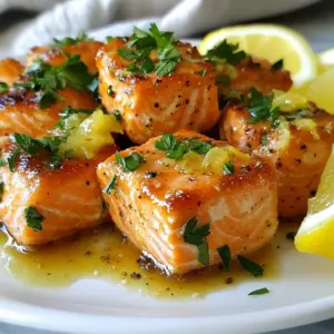 - 1 lb skinless salmon fillet, cut into 1-inch cubes - 3 tablespoons unsalted butter - 4 cloves garlic, finely minced - Juice and zest of 1 large lemon - 1 tablespoon fresh parsley, finely chopped (plus extra for garnish) - Salt and freshly ground black pepper to taste - Lemon wedges for serving The key to making Lemon Garlic Butter Salmon Bites is using fresh ingredients. Salmon is full of healthy fats and protein, making it a great choice. I love using skinless salmon fillets. They cook nicely and are easy to cut into cubes. Butter adds rich flavor. Unsalted butter lets you control the salt. Fresh garlic gives a sweet, aromatic touch. Make sure to mince the garlic finely for even cooking. For brightness, lemon juice and zest are essential. They balance the fat and enhance the dish. Chopped parsley adds a fresh note. It also makes the dish look pretty. For seasoning, I suggest using salt and freshly ground black pepper. These simple seasonings let the salmon shine. Finally, serve with lemon wedges on the side. They add a zing and can brighten up each bite. Enjoy this dish with your favorite sides for a complete meal! {{ingredient_image_2}} First, rinse the salmon cubes under cool running water. This helps remove any residue. Next, gently pat the salmon dry using paper towels. Drying is key for a nice sear. Now, season the salmon cubes with salt and freshly ground black pepper. Make sure to coat all sides well for great flavor. In a large non-stick skillet, melt the unsalted butter over medium heat. Wait until it bubbles, then add the finely minced garlic. Saut&eacute; the garlic for about 1-2 minutes. Stir often until it becomes fragrant and lightly golden. Be careful not to burn it, as that can ruin the taste. Next, increase the heat to medium-high. Add the seasoned salmon cubes in a single layer. Make sure they have space to cook. Let them sear undisturbed for about 2-3 minutes. Look for a golden-brown crust on one side. Now, gently flip each salmon bite over using a spatula. Lower the heat back to medium. Squeeze fresh lemon juice over the salmon, then add the lemon zest and chopped parsley. Cook for another 2-3 minutes. The salmon should be opaque and flake easily with a fork. This keeps it moist and tender. Once the salmon bites are done, remove the skillet from heat. Let the bites rest for about a minute. This helps the flavors settle. For a nice finish, garnish with more chopped parsley. Serve right away with fresh lemon wedges on the side. The lemon adds a bright, zesty flavor that pairs perfectly. To make these salmon bites truly shine, start with the right seasoning. Use a good amount of salt and freshly ground black pepper. This helps enhance the salmon's natural flavor. I recommend seasoning the salmon cubes well on all sides before cooking. This small step makes a big difference. For cooking time, aim for 2-3 minutes per side. You want a golden-brown crust. After flipping, cook for another 2-3 minutes. The salmon should be opaque and flake easily. This ensures a moist and tender bite. To take the flavor up a notch, consider adding spices or herbs. A pinch of cayenne can add a nice kick. Fresh dill or thyme could also work well. Experiment with what you like! For sides, I suggest serving these salmon bites with a fresh salad or steamed veggies. Rice or quinoa also pairs nicely. These options balance the rich butter and lemon flavors. Presentation matters, especially for a dish like this. Use a clean white plate to show off the colors. Arrange the salmon bites in a neat line or cluster. For garnishing, sprinkle extra parsley on top. You can also add a lemon wedge on the side. This not only looks good but also gives a fresh burst of flavor. Pro Tips Choose Fresh Salmon: Always opt for fresh salmon for the best flavor and texture. Look for bright, shiny skin and a mild scent. Perfectly Melted Butter: Make sure the butter is completely melted before adding garlic to prevent it from burning and developing a bitter taste. Don&rsquo;t Overcrowd the Pan: Cook the salmon in batches if necessary to ensure proper searing and to achieve that golden-brown crust. Rest Before Serving: Allow the salmon bites to rest for a minute after cooking. This helps to lock in the juices for a more flavorful bite. {{image_4}} You can change the taste of your lemon garlic butter salmon bites. One way is to make a spicy lemon garlic butter. Add some red pepper flakes or cayenne pepper to the butter and garlic mix. This will give your dish a nice kick. Another option is to use herbs de Provence. This mix has dried herbs like thyme, rosemary, and basil. Just sprinkle some into your butter and garlic before cooking the salmon. It gives a lovely herbal flavor that pairs well with the fish. If you want to switch things up, try using shrimp or chicken bites. For shrimp, cook until they turn pink and opaque. They will take less time than salmon, so watch them closely. You can also try a vegetarian option with tofu. Use firm tofu and cut it into cubes. Marinate it in the lemon garlic butter mix before cooking. This gives the tofu a burst of flavor while keeping it light. You can cook these salmon bites in an air fryer for a quicker option. Set the air fryer to 400&deg;F (200&deg;C). Cook the salmon bites for about 8-10 minutes, turning halfway through. This method makes them crispy and delicious. Grilling is another fantastic way to prepare these bites. Preheat your grill to medium heat. Thread the salmon onto skewers for easy handling. Grill for about 3-4 minutes on each side. This will add a smoky flavor that enhances the dish. To keep your Lemon Garlic Butter Salmon Bites fresh, store them in an airtight container. Make sure the container seals well to prevent air from entering. Place the salmon bites in the fridge within two hours of cooking. They will stay fresh for up to three days. If you notice any off smells or changes in color, it's best to discard them. When it&rsquo;s time to enjoy leftovers, the best method to reheat salmon bites is using a skillet. Heat a small amount of butter or oil over medium heat. Add the salmon bites and cook for about two to three minutes on each side. This method helps keep the texture nice and flaky. Avoid using the microwave, as it can make the salmon rubbery. If you must use a microwave, heat on low power for short bursts. Freezing is a great way to save leftover salmon bites. Start by letting them cool completely. Then, arrange the bites in a single layer on a baking sheet and freeze them for one to two hours. Once frozen, transfer the bites to a freezer-safe bag or container. They can last up to three months in the freezer. When you're ready to eat, thaw the salmon bites in the fridge overnight. Reheat them using the skillet method for the best results. Yes, you can use frozen salmon. Just remember to thaw it first. The best way to thaw salmon is in the fridge overnight. If you're short on time, you can seal it in a bag and place it under cold water for about an hour. Make sure it&rsquo;s fully thawed before cooking. This way, the salmon cooks evenly and tastes great. Lemon Garlic Butter Salmon Bites taste great with many sides. Here are a few quick ideas: - Steamed broccoli or asparagus - Garlic mashed potatoes - A fresh green salad with lemon vinaigrette - Quinoa or rice for a filling option These sides add color and flavor to your meal. To check if your salmon is done, look for a few signs: - The salmon should turn opaque and flake easily with a fork. - The center should not be translucent. - You can also use a food thermometer. It should read 145&deg;F (63&deg;C) for safe eating. These tips help ensure your salmon is perfect every time. This blog post covered how to make delicious Lemon Garlic Butter Salmon Bites. We discussed the key ingredients, including salmon, butter, and garlic, and shared step-by-step instructions for perfect preparation. I provided tips for enhancing flavor and offered ideas for presentation. You also learned about different variations, proper storage, and reheating methods. In conclusion, salmon bites are easy to make and full of flavor. Enjoy experimenting with different spices and sides to make this dish your own. Your kitchen will soon smell amazing, and your taste buds will thank you!